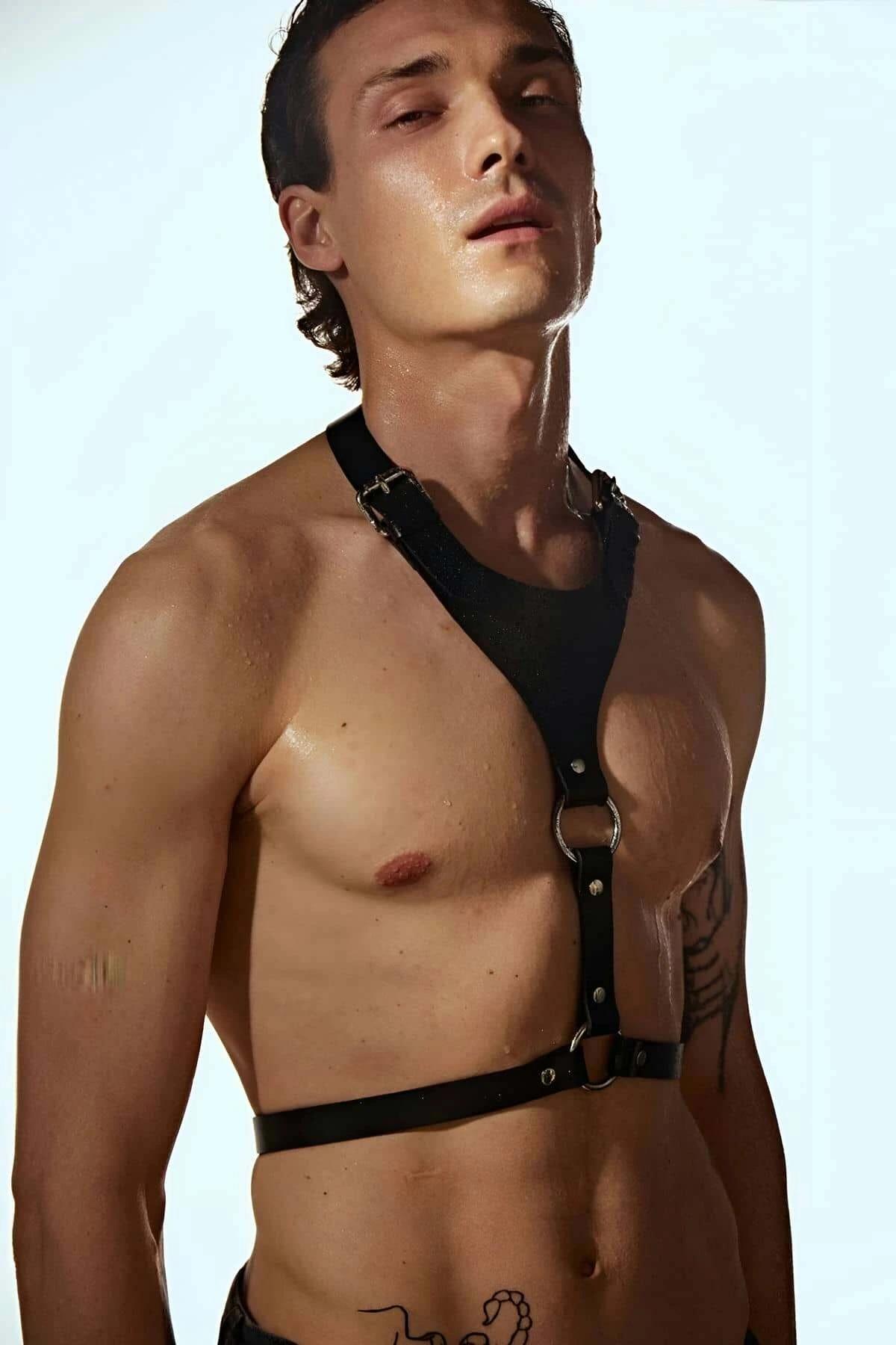 Black faux leather chest harness with metal rings and buckle straps