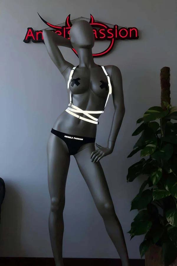 Black reflective body harness straps silver X-cross chest and midriff band on mannequin
