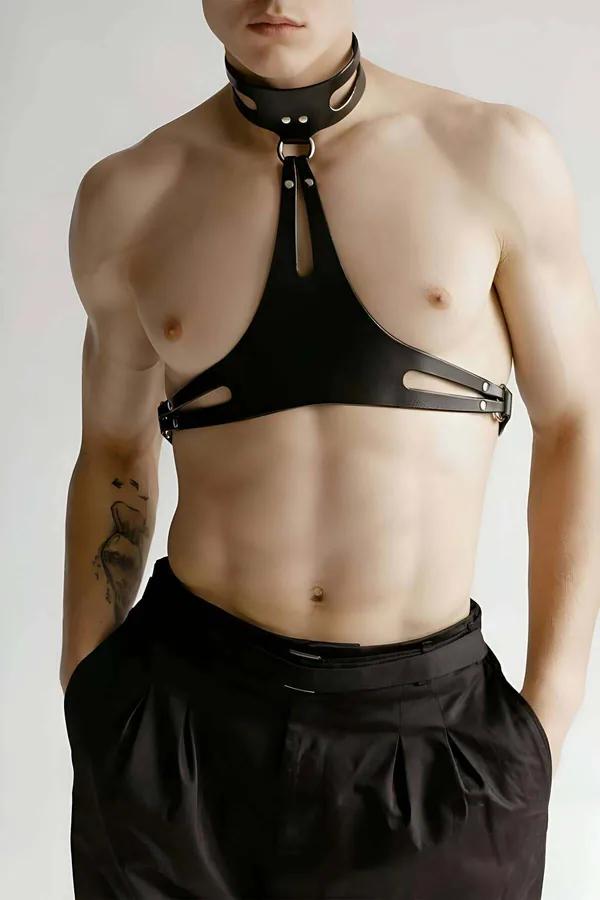 Black faux leather chest harness with cut-out choker collar, triangular panel, silver O-ring and dome rivets, worn by male mo